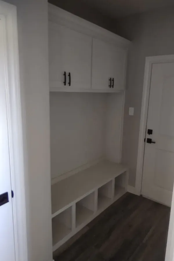 There is a bench in the middle of the room.