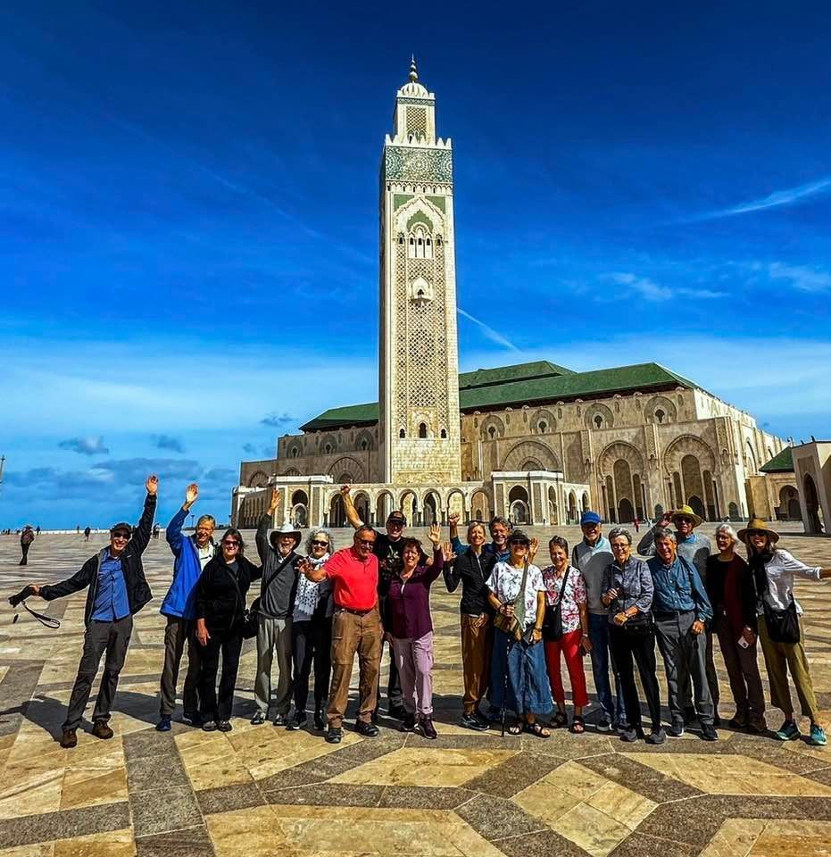 Vacation Travel to Morocco - A group of people standing in front of a mosque in Casablanca