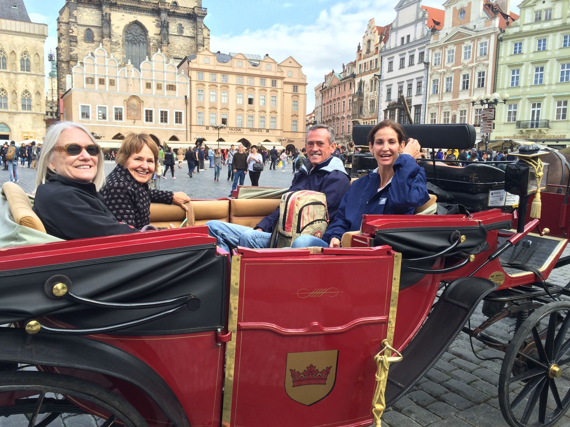 Guided Vacation Travel to Eastern Europe - A group of people sitting in a horse drawn carriage