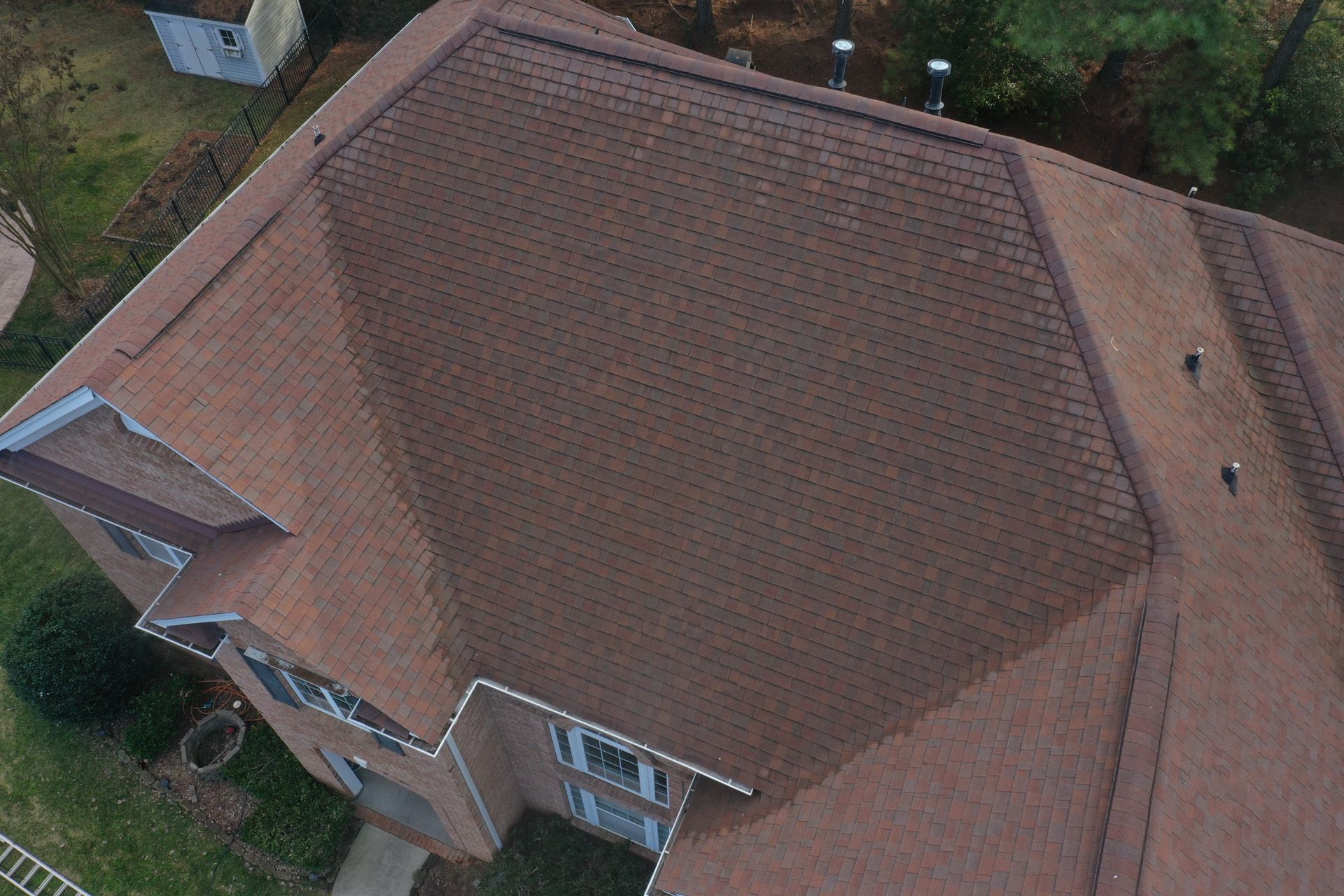 The side of a house with a window and an air conditioner.