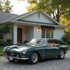 Green vintage Mercedes convertible parked in front of a white house with an awning.