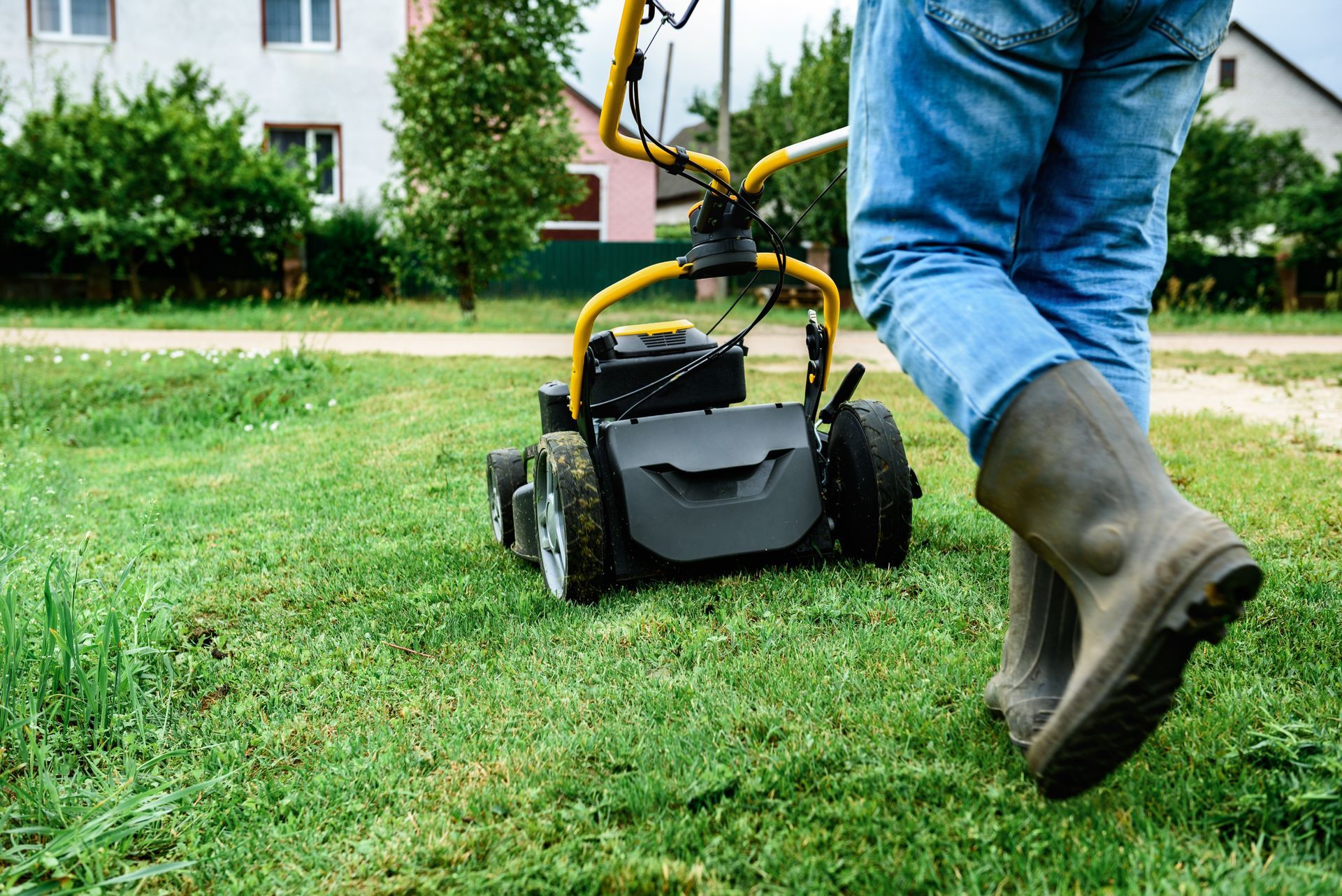 Family gathered at a dining table in a kitchen. They are eating and talking together.