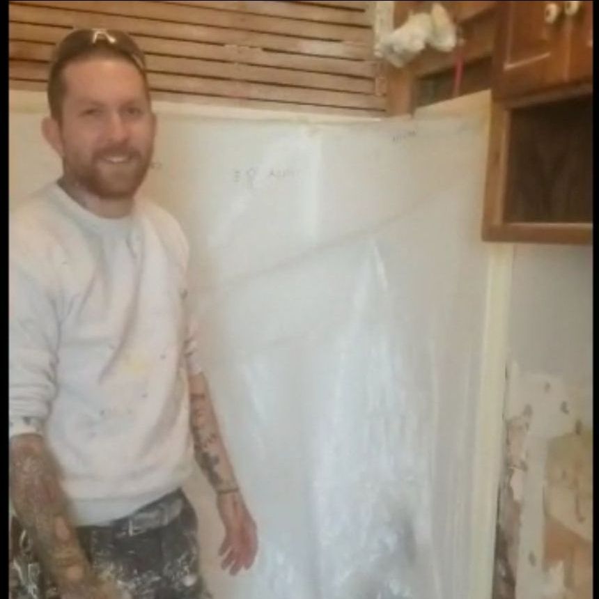 Paint-Right Painting owner Chris Wright stands in front of an interior demo project. 