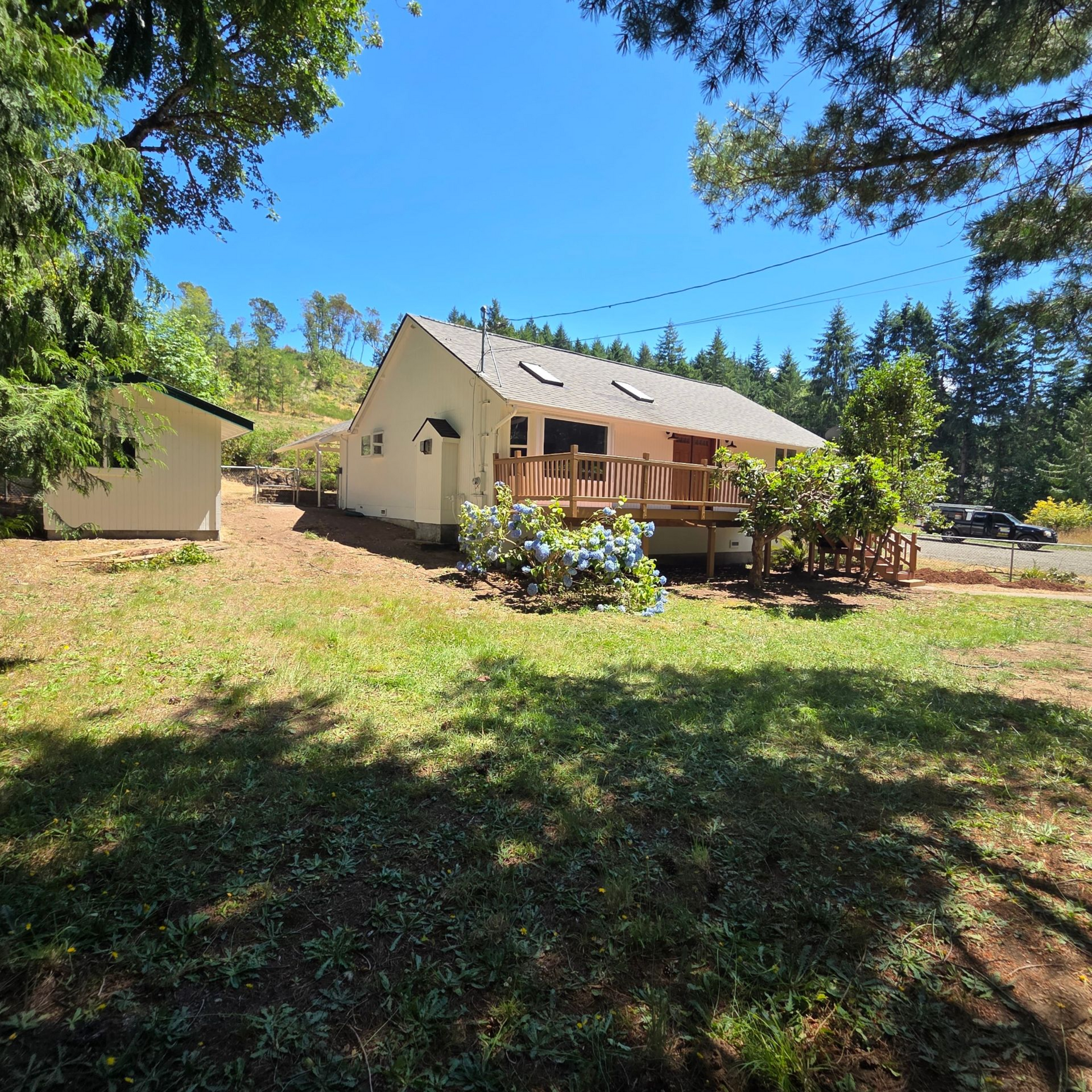 Rain pouring out of a downspout flushes put leaves and debri caught in the gutter. 