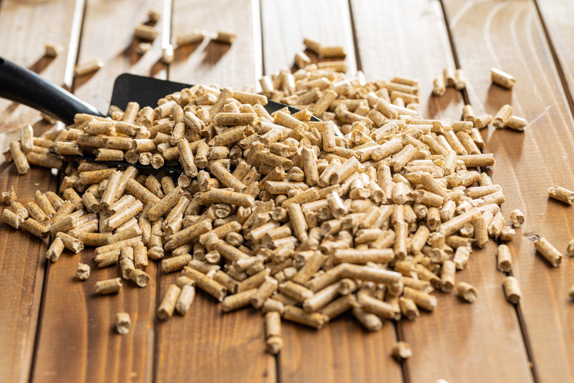 scoop in a pile of wood pellets