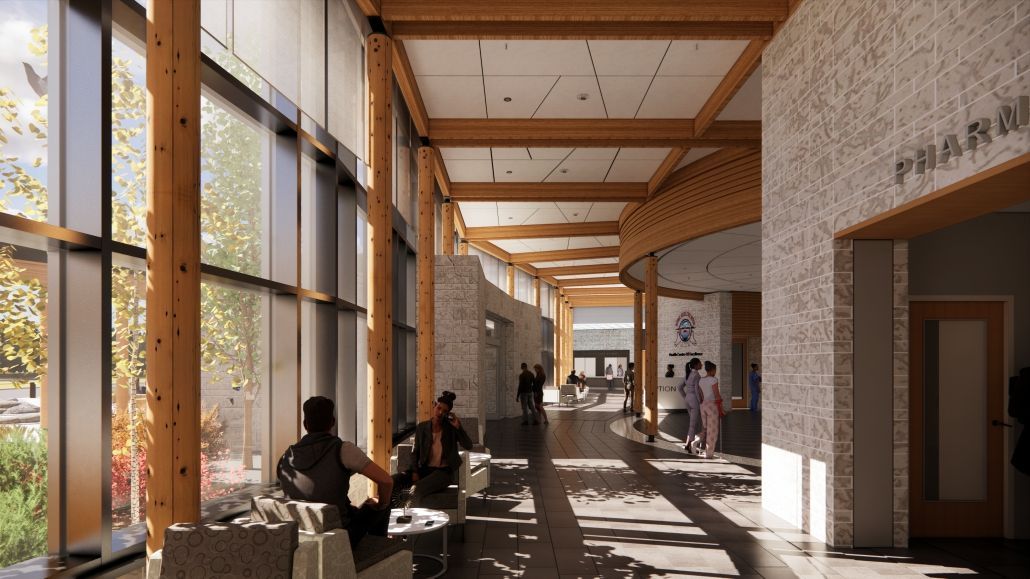 A long hallway with a lot of windows and a sign that says pharmacy.