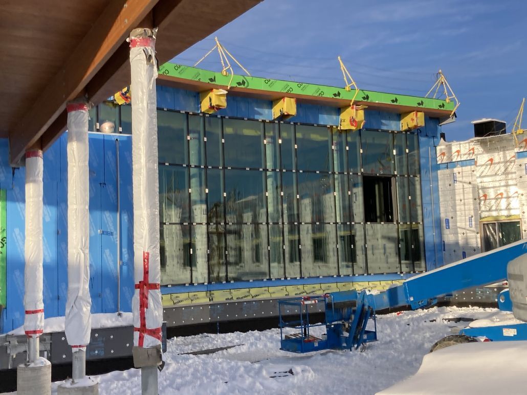 A large building is being built in the snow