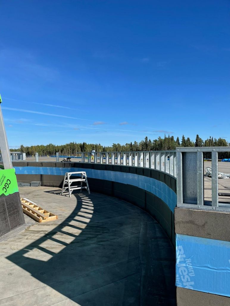 A construction site with a fence and a sign that says ' a ' on it