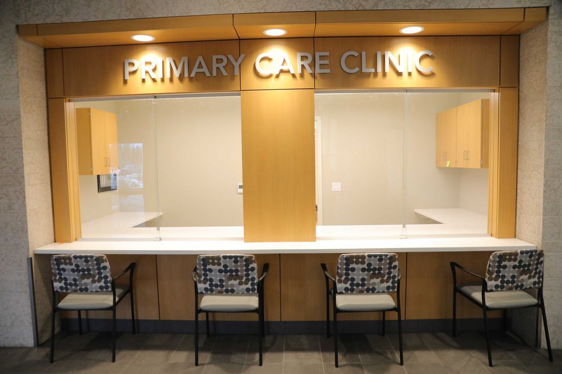 A primary care clinic with chairs and a counter