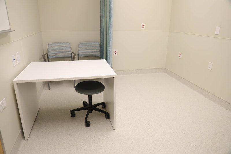 There is a desk and chair in the room.