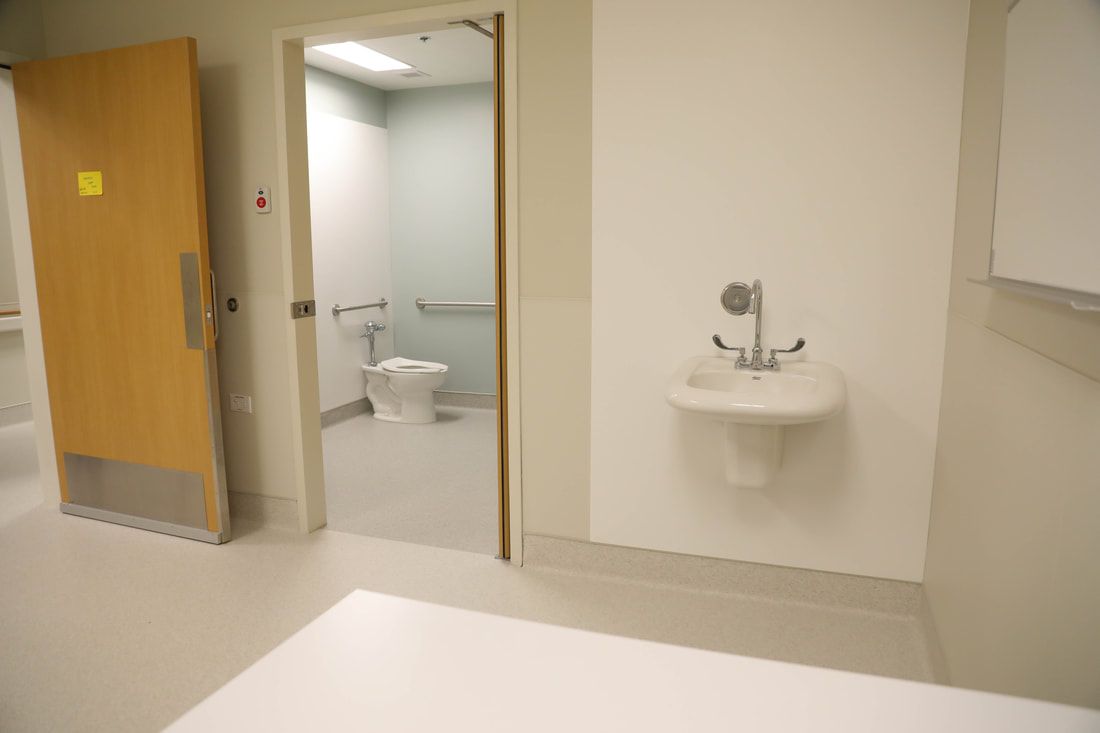 A bathroom with a sink and a toilet in it