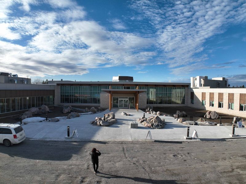 A large building with a lot of windows is being built