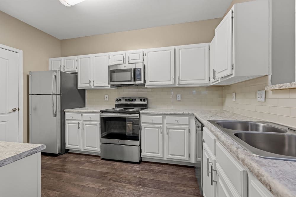 Modern Kitchen with Stainless Steel Appliances at The Marq at Brookhaven