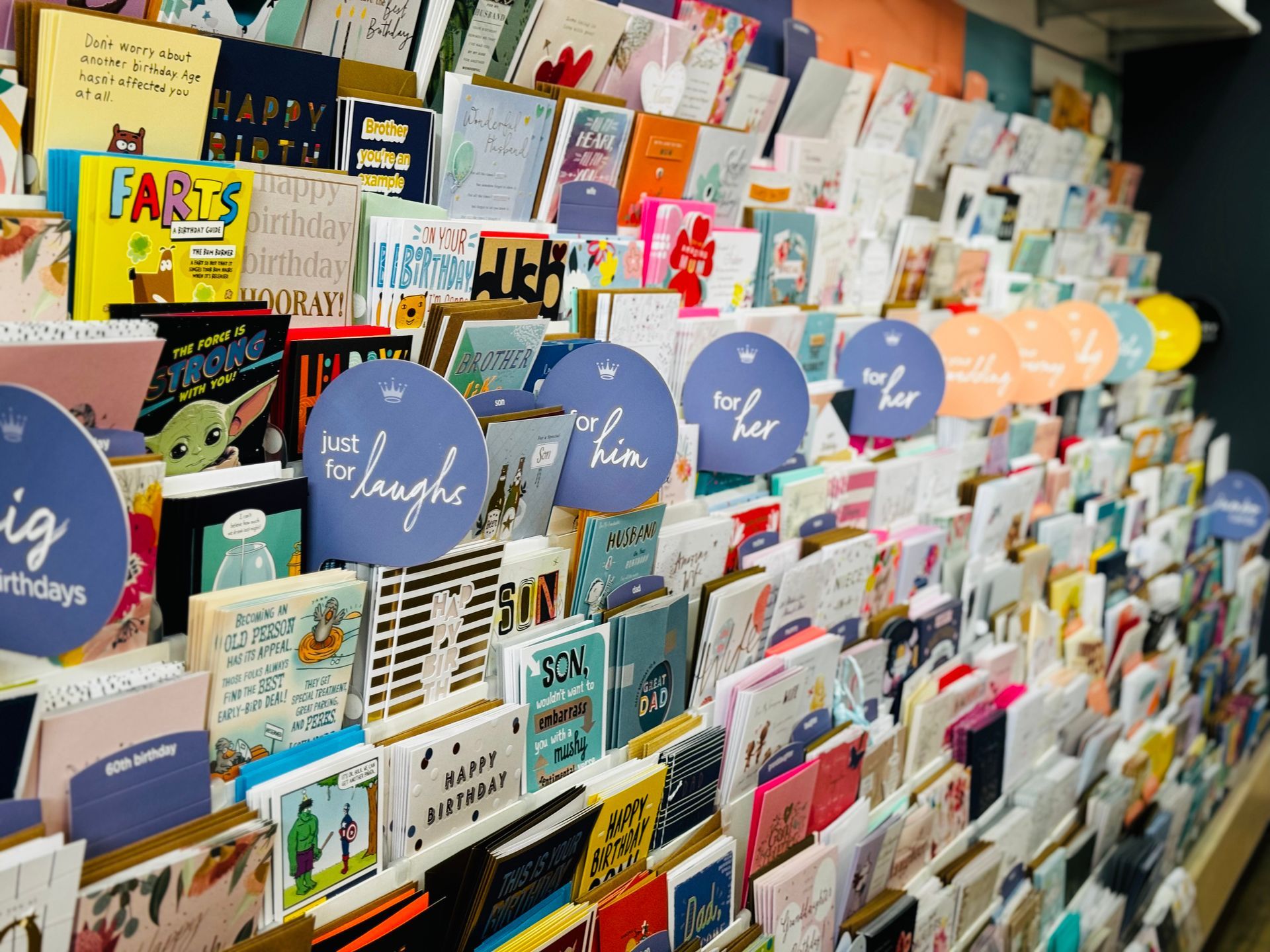 A Shelf In A Store Filled With Lots Of Different Items — Yeppoon Central Lotto & News in Yeppoon, QLD