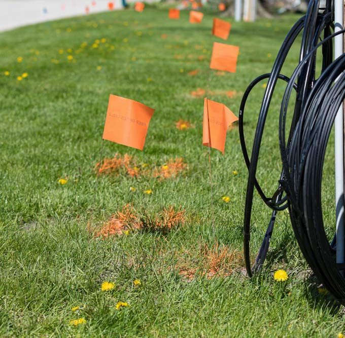 Marking Flags And A Utility Pole For Underground Cable Detection — Porta-Vac in Proserpine, QLD