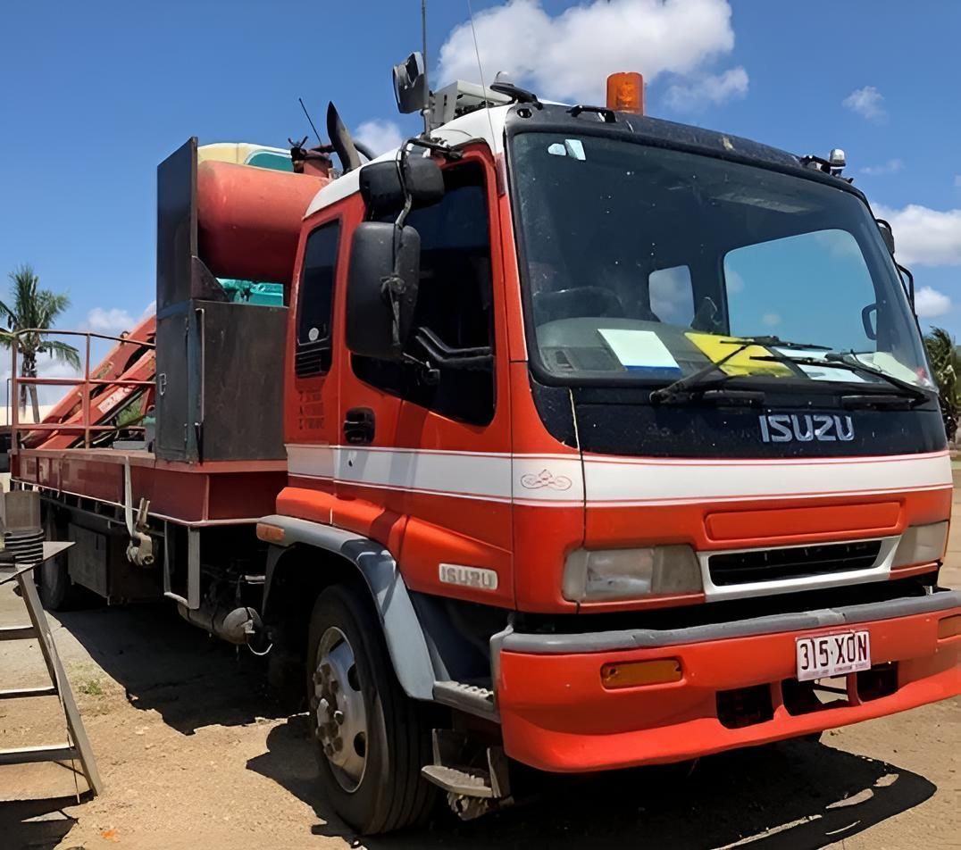 An Isuzu Truck Is Parked On The Side Of The Road — Porta-Vac in Bowen, QLD