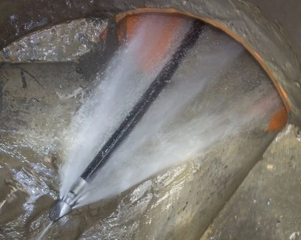 A Tunnel Has A Hose With Water Coming Out Of It — Porta-Vac in Bowen, QLD