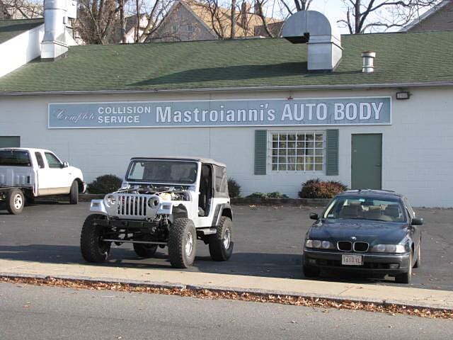 Cars outside of a building - Auto body shop in Springfield, MA