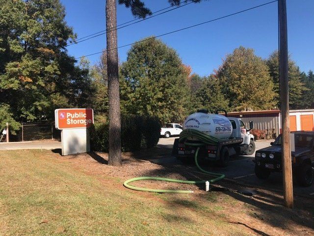 Ongoing Sewer Pumped By A Truck Another Angle — Statham, GA — Affordable Septic Service