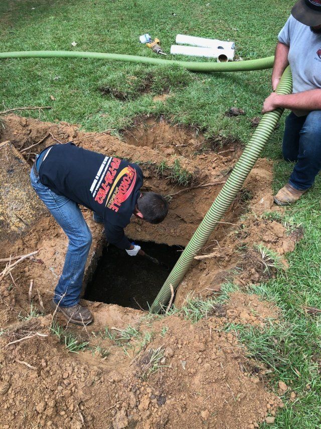 Man Peeking Through The Hole — Statham, GA — Affordable Septic Service