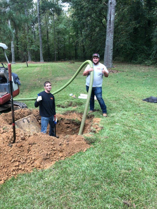 Men Currently Working On Sewer Pumps — Statham, GA — Affordable Septic Service