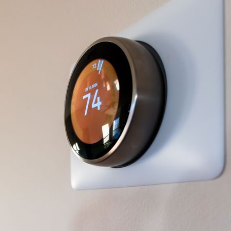 A thermostat that has the number 74 on it