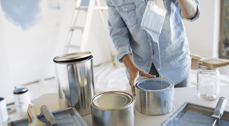 A decorator mixing paint