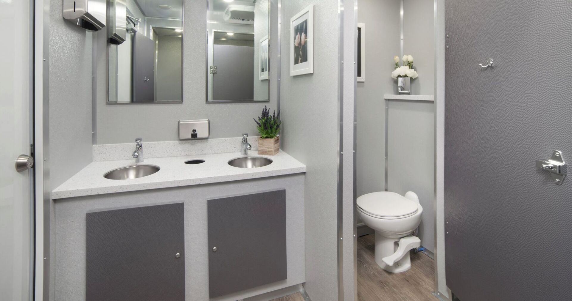 A bathroom with two sinks and a toilet. — Hattiesburg, MS — Gotta Go Site Service Rentals