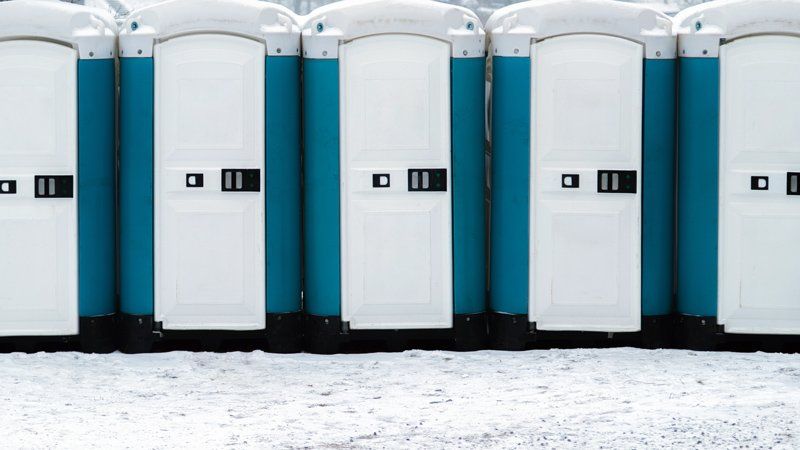 Mobile Toilets Outside on the Snowy Ground — Jackson, MS — Gotta Go Site Service Rentals