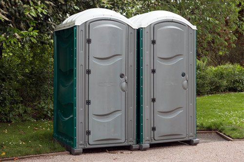 Portable Toilets In Yard