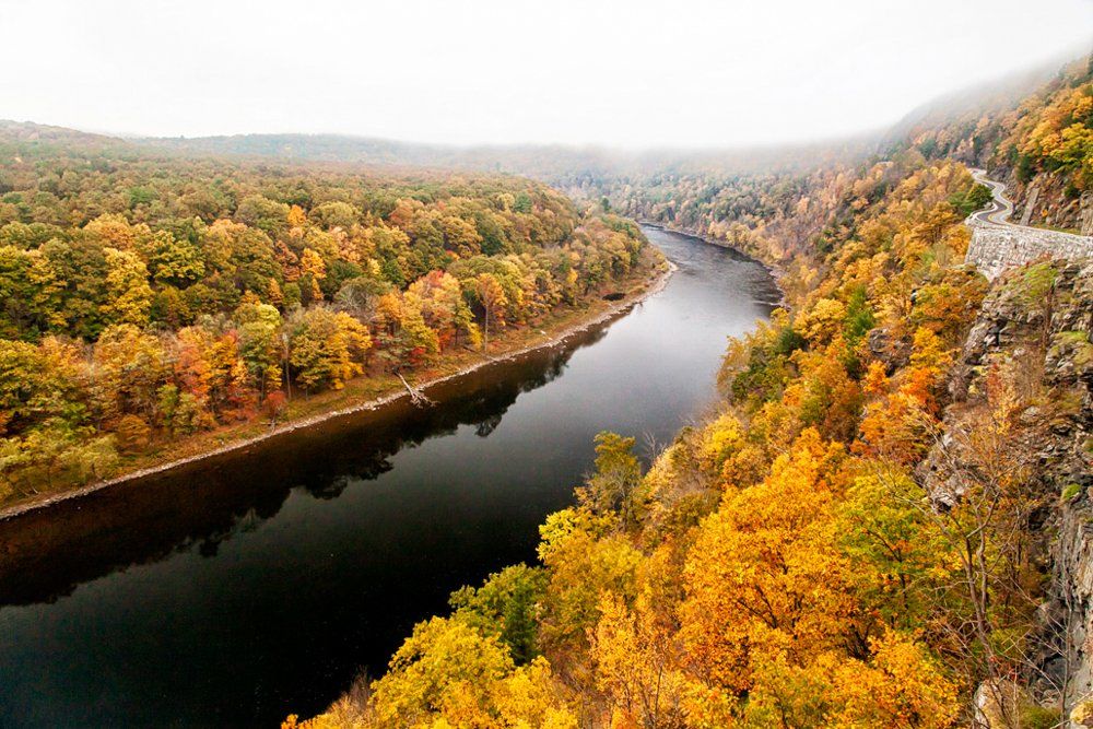 A stretch of the Upper Delaware Scenic and Recreational River is shown in a view from the Hawk's Nest highway in Sparrow Bush, NY, amid fall foliage.