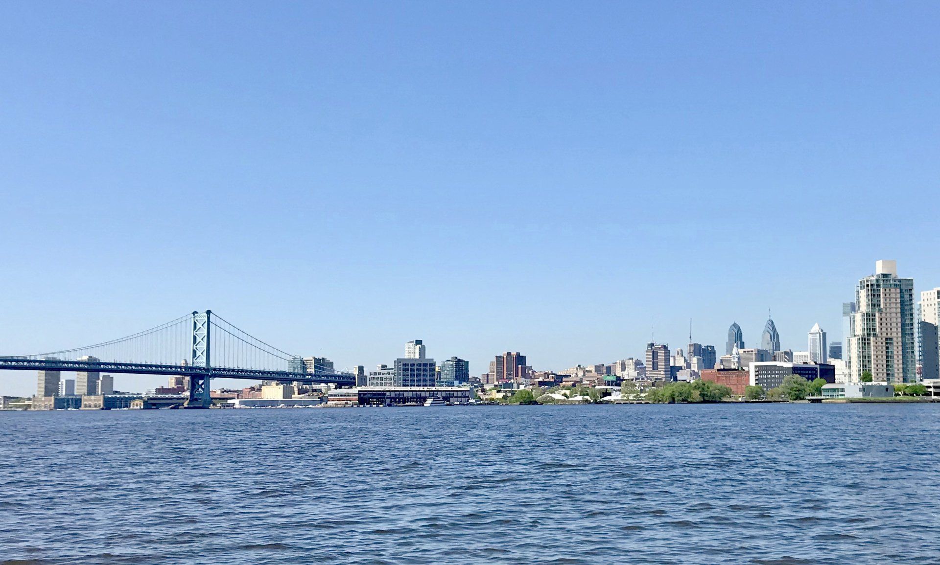The Delaware River at Philadelphia includes a view of the Philadelphia skyline and the Ben Franklin Bridge.