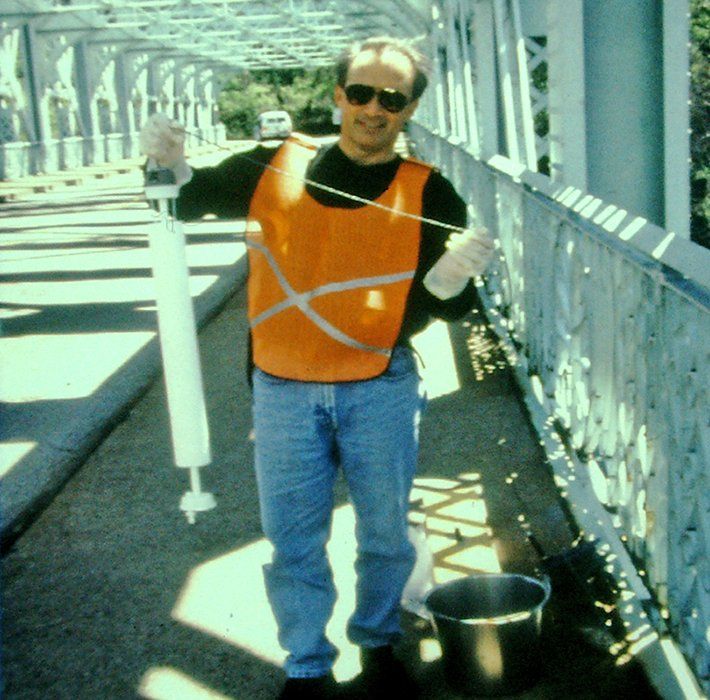 The DRBC staff poses on the Falls Bridge with sampling equipment used for water quality monitoring in the Schuylkill River.