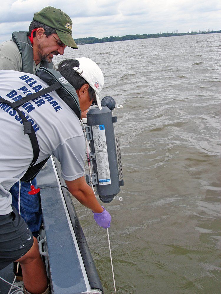 The DRBC staff collect water samples as part of the agency's work to curb PCBs in the tidal Delaware River.