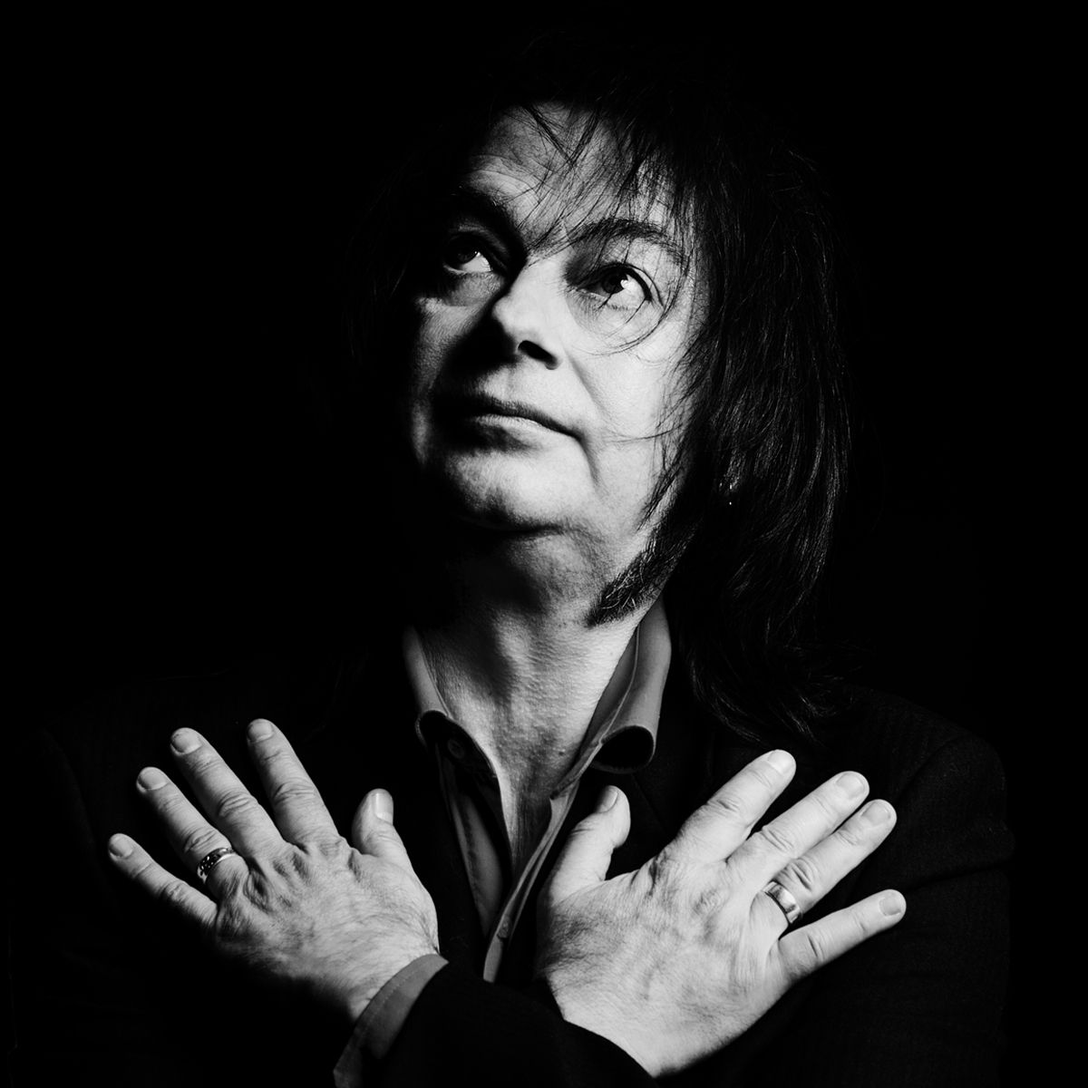 A black and white photo of Nigel from The Go Go Cult with his hands on his chest - shot by Dammo Photography