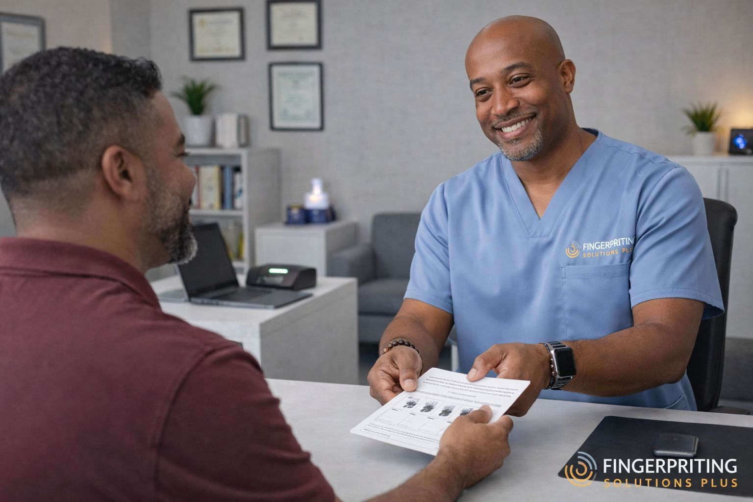 Mobile Fingerprinting Solutions Plus technician assisting a CEO during an on-site corporate fingerprinting appointment
