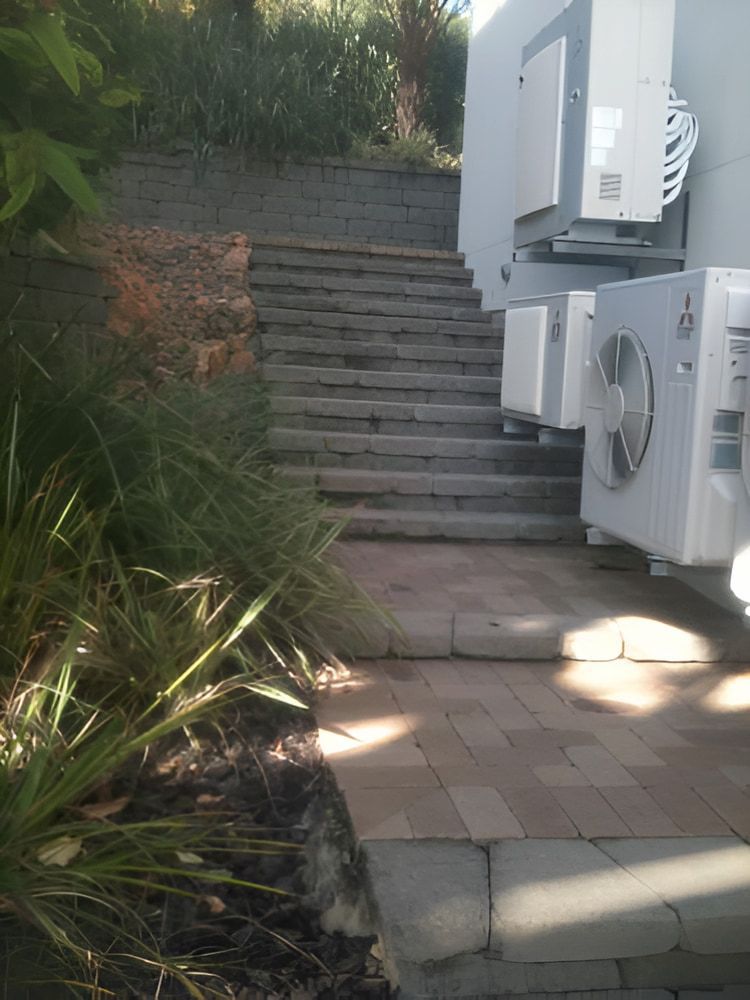 A Bunch Of Colourful Flowers Are Growing In A Garden — Baker & Co. Landscape Construction In Gulliver, QLD