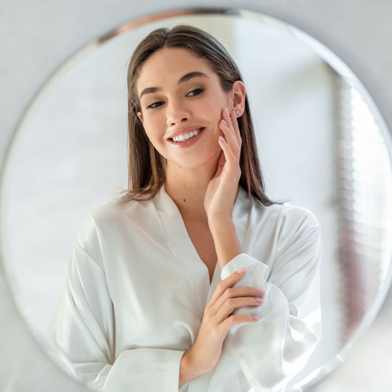 woman smiling in the mirror