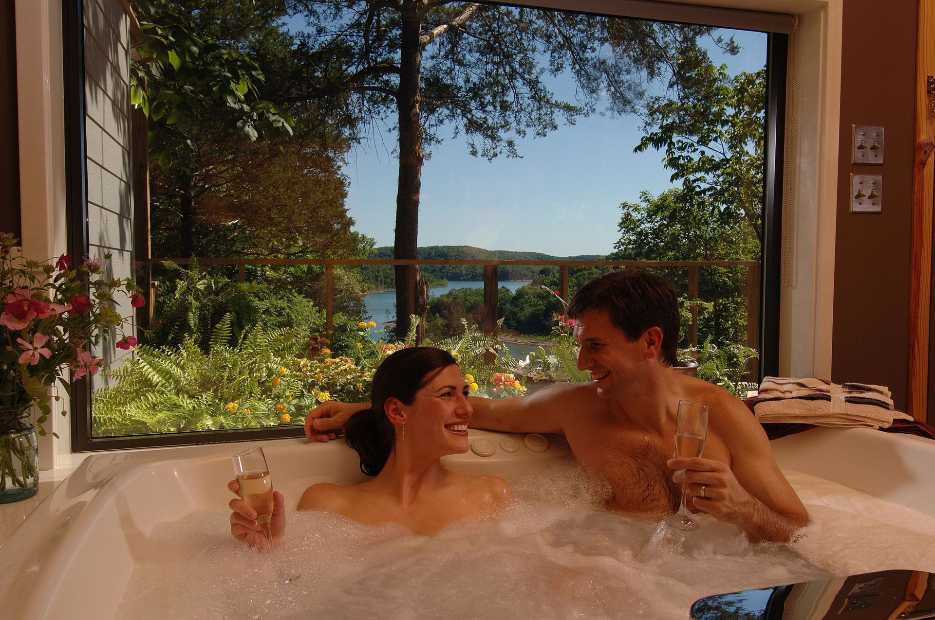 A man and a woman are taking a bath together