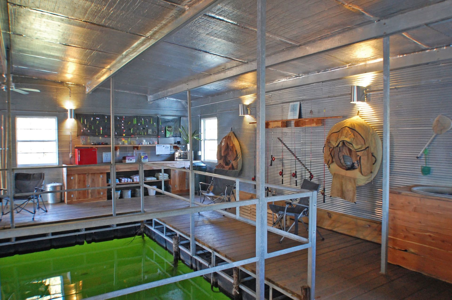 A large room with a swimming pool in the middle of it