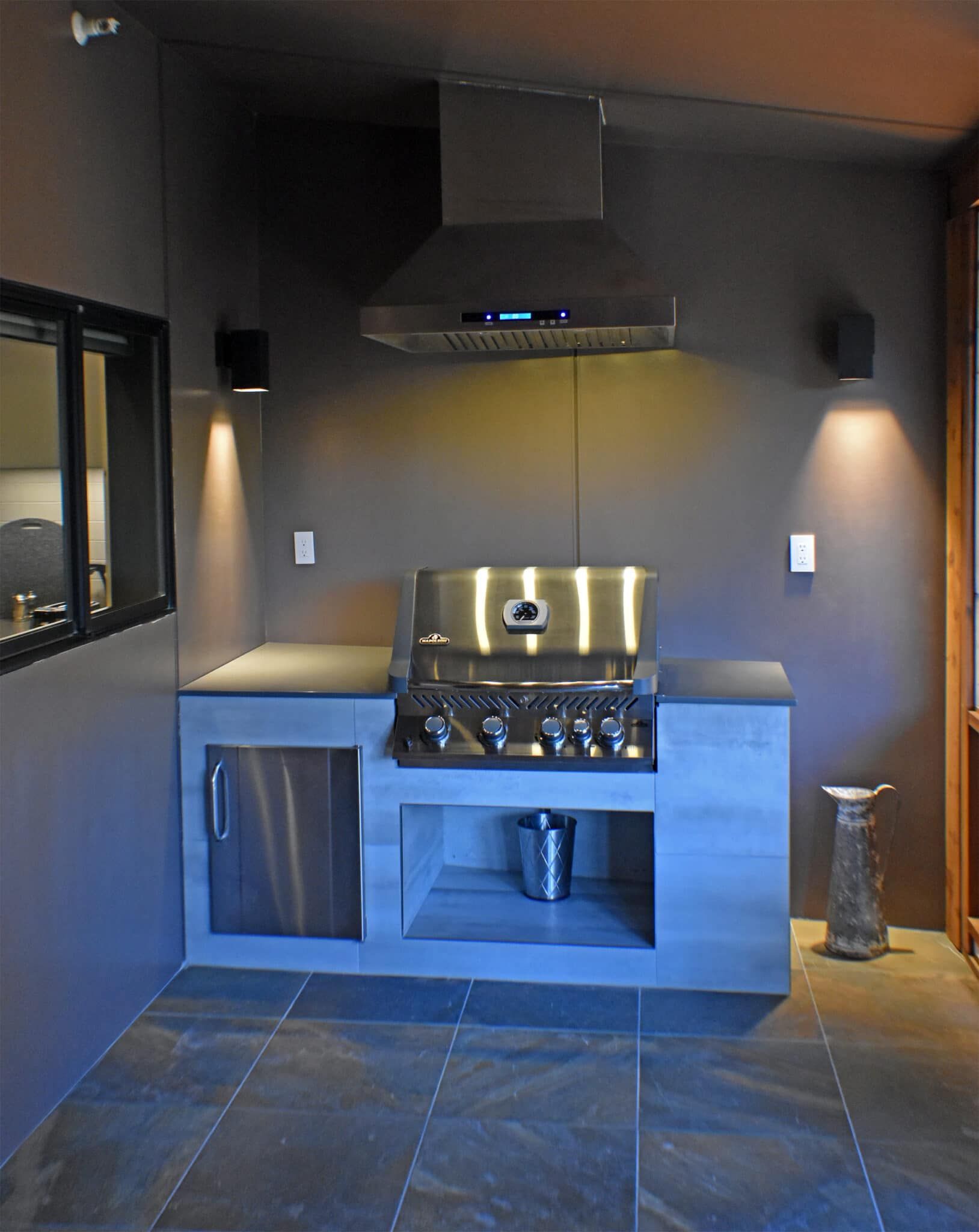 A kitchen with a stainless steel stove top oven