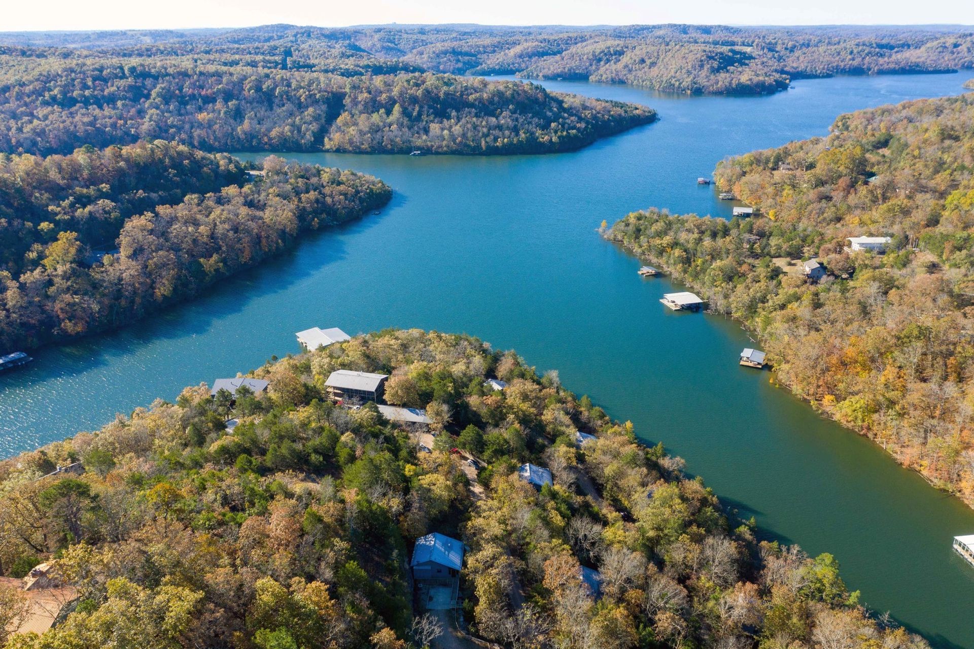 An aerial view of a large body of water surrounded by trees.