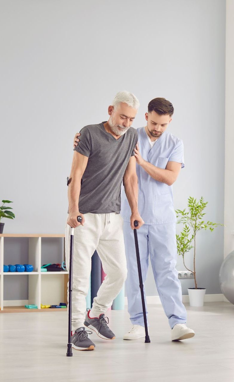 Person in blue leggings exercising with a cable machine, indoors. Focus on the leg and foot.