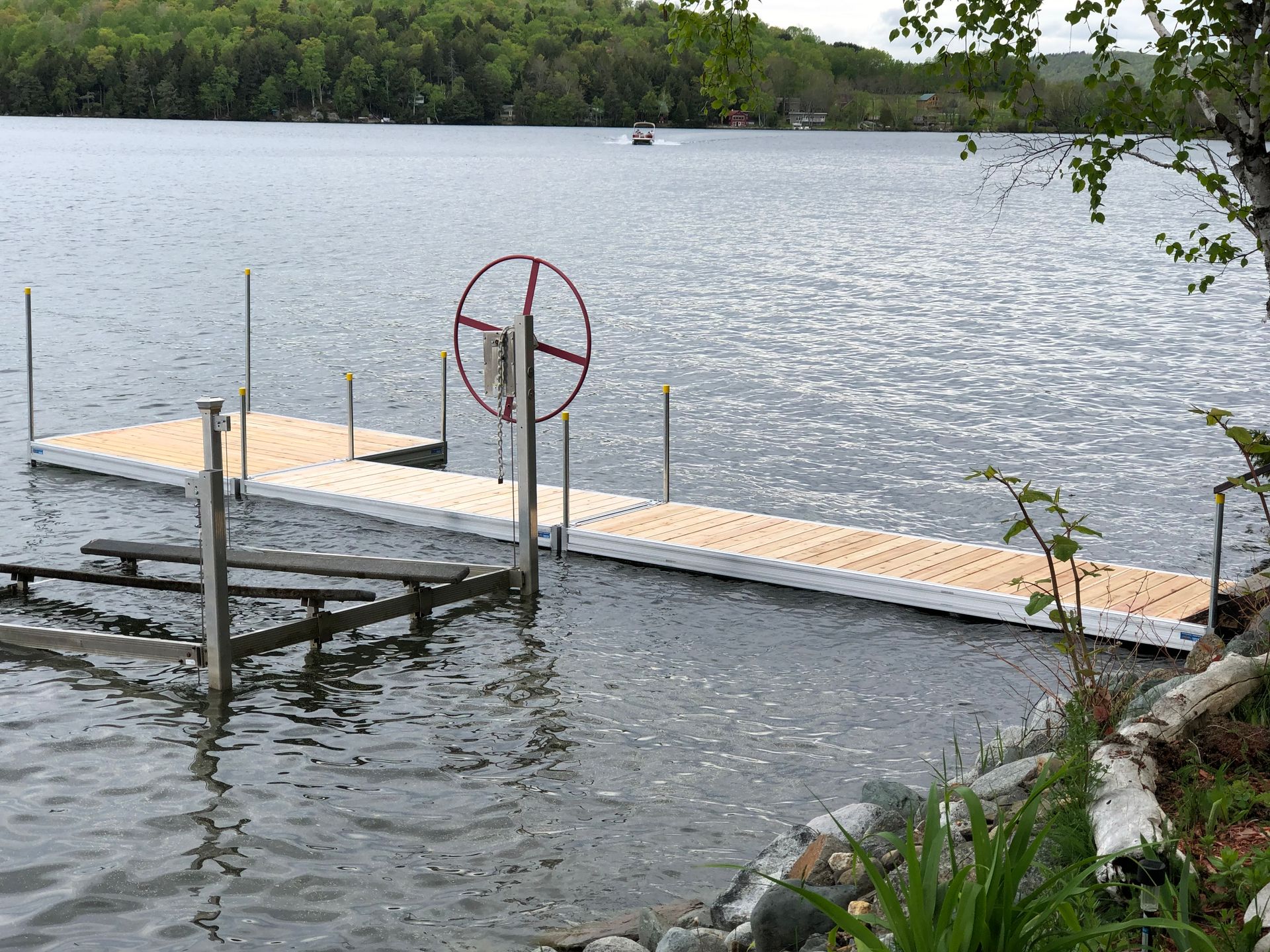 There is a dock in the middle of a lake.