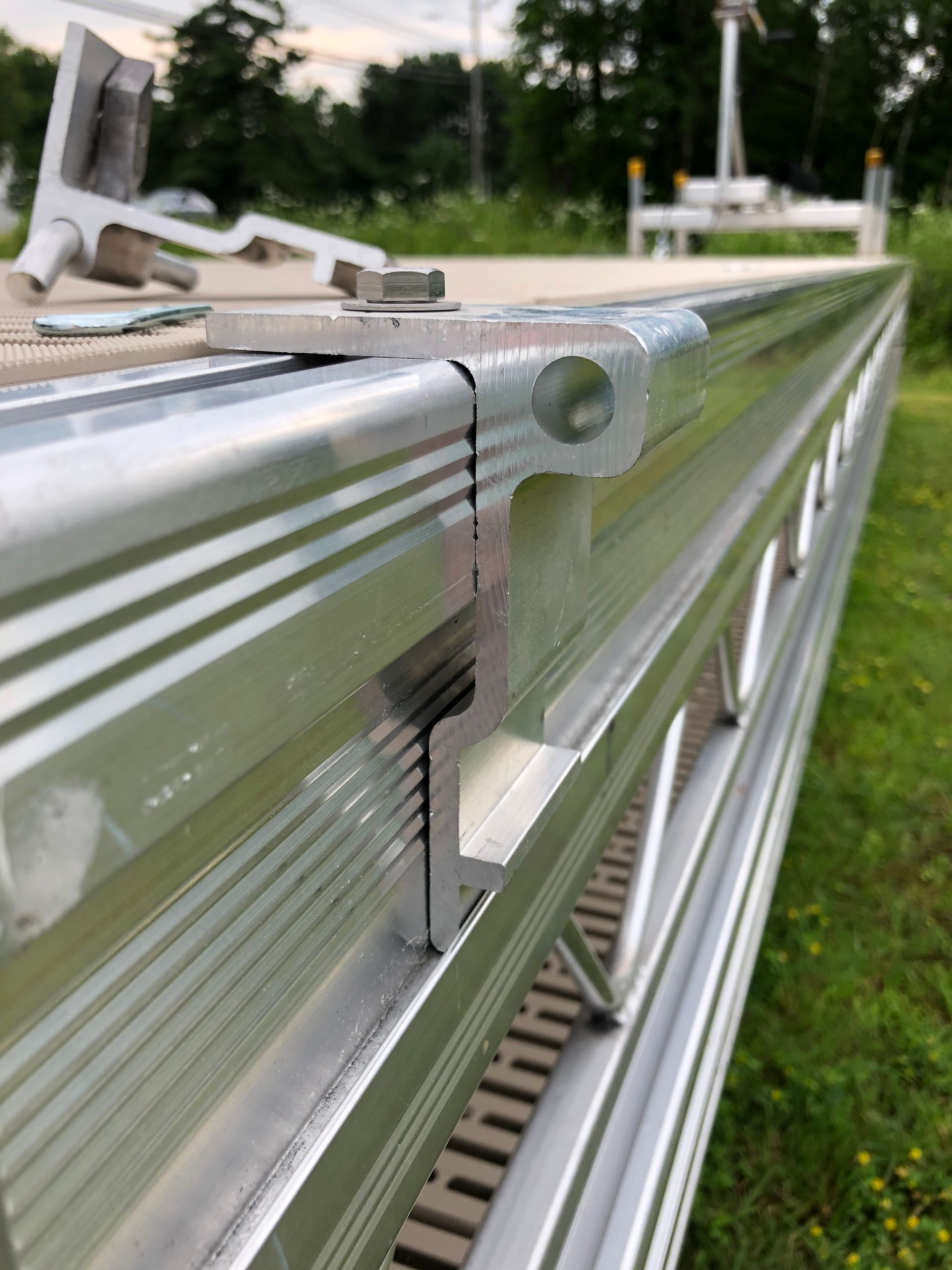 A close up of a metal structure in a field.