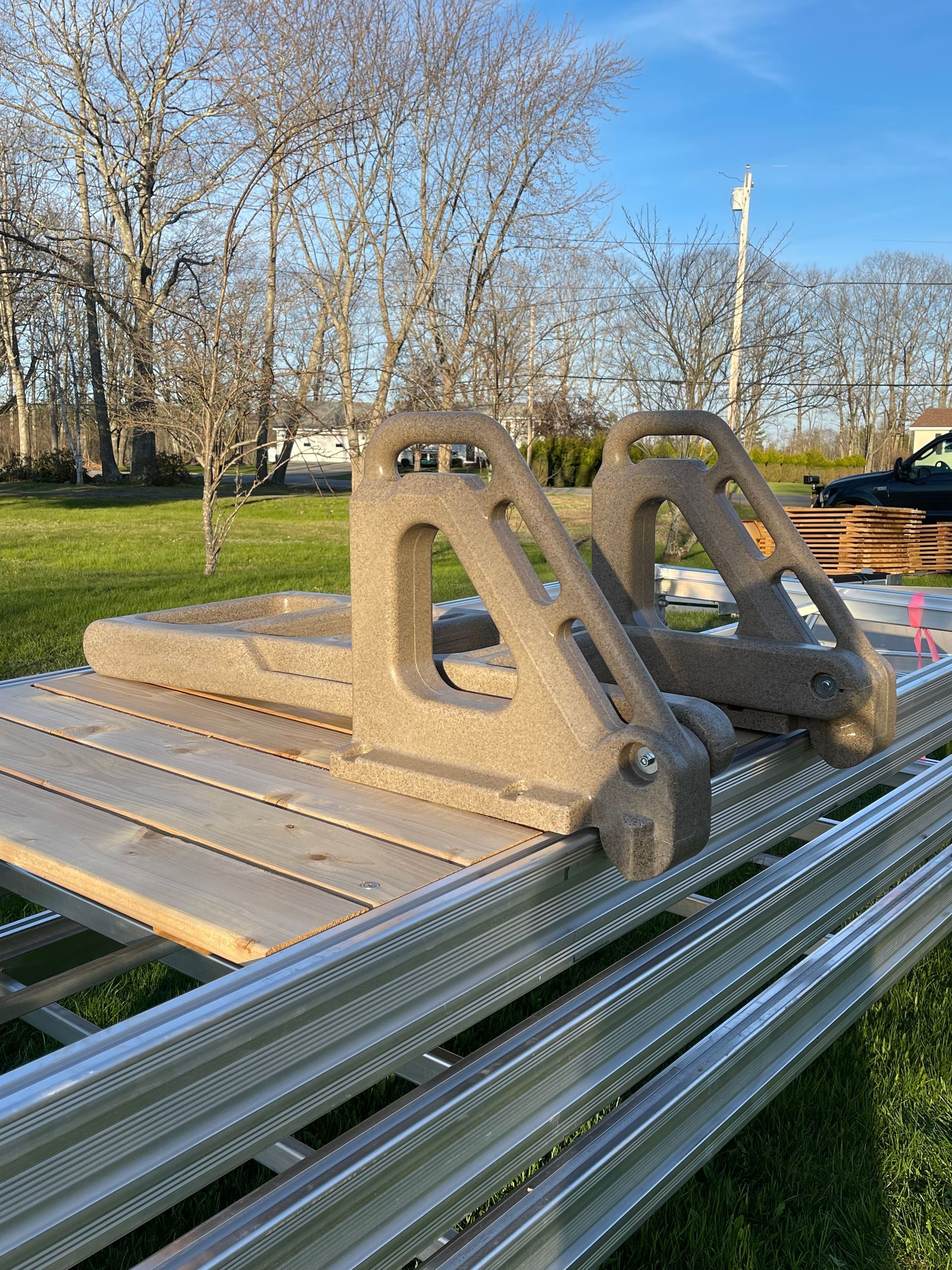 A couple of pieces of metal sitting on top of a wooden table.