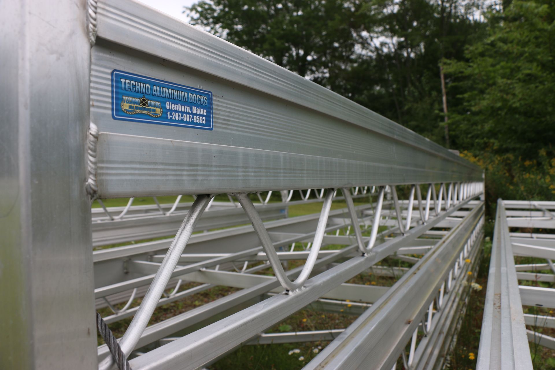 A close up of a metal structure with a sticker on it