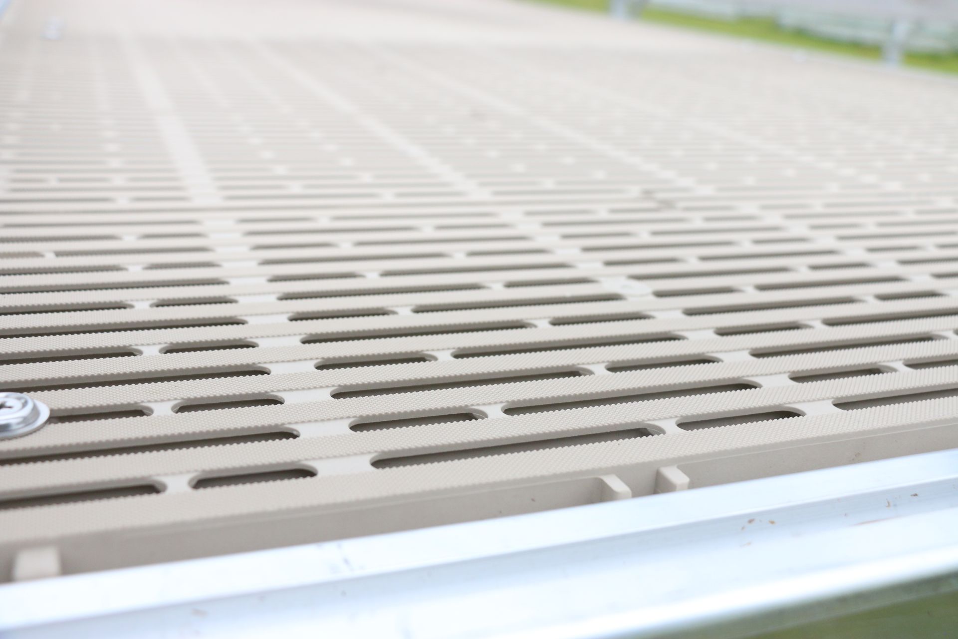 A close up of a dock with holes in it.