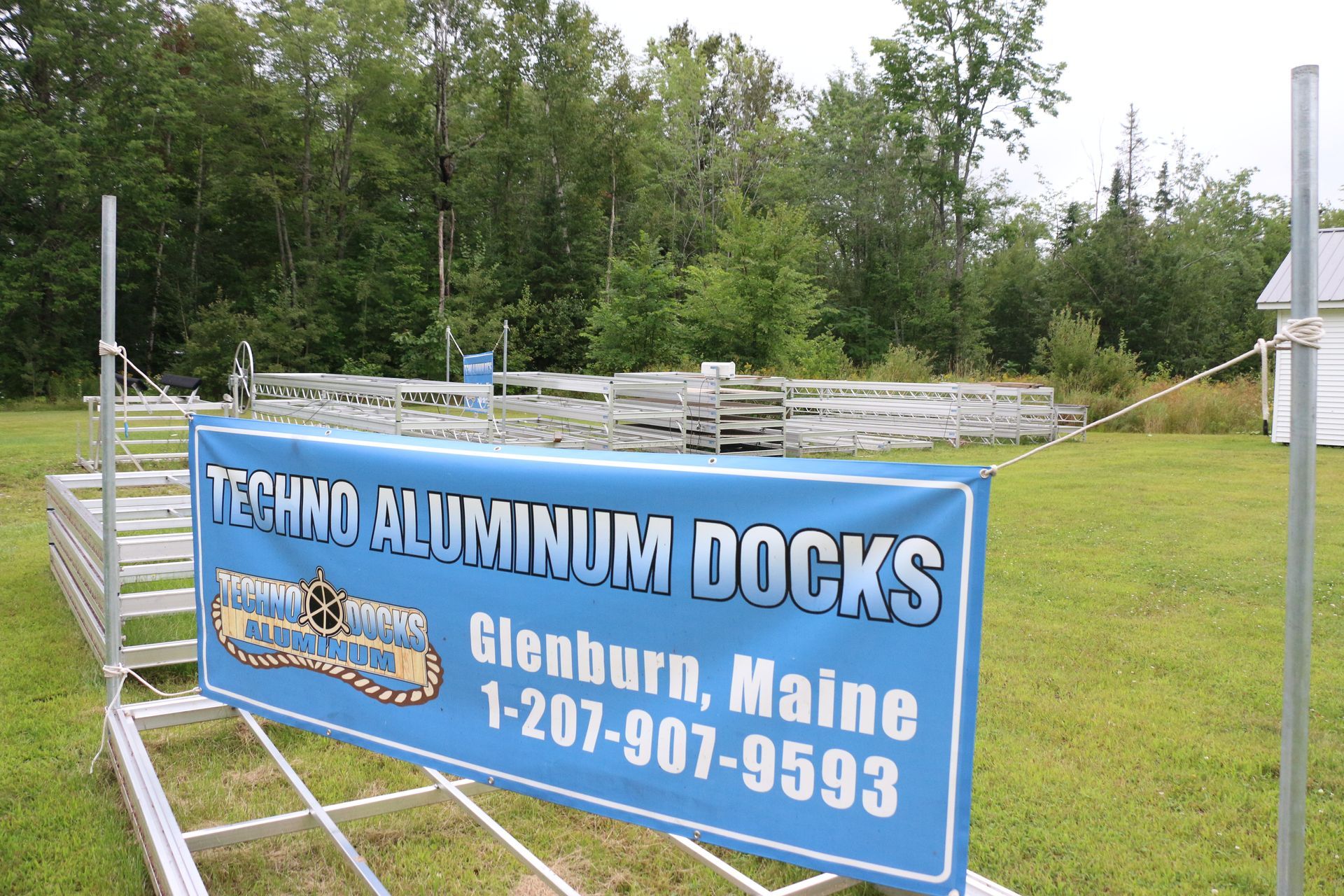A sign for techno aluminum docks in glenburn maine