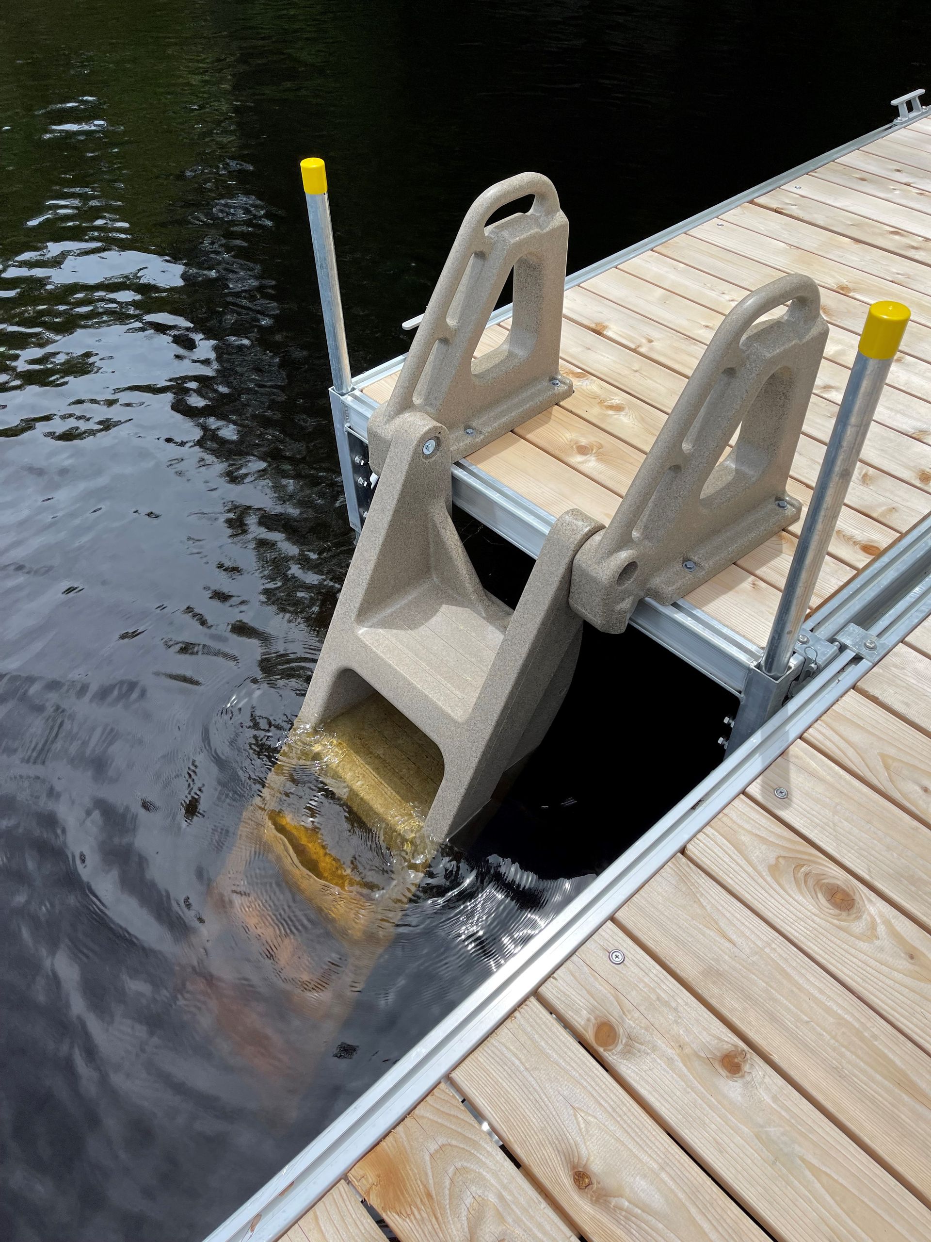 A dock with a ladder going into the water